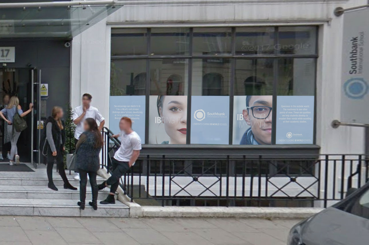 An image of the outside of the school showing the campaign branding in the windows